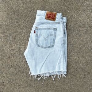 Women’s light wash Levi’s jean shorts with patchwork